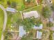 Bird's-eye view of community buildings and recreational area featuring a sand volleyball court and community garden at 734 Flamingo Dr, Apollo Beach, FL 33572