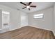 This bright bedroom features neutral walls, wood-look flooring and closet at 734 Flamingo Dr, Apollo Beach, FL 33572