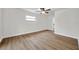 Bright bedroom features neutral walls and wood-look flooring throughout at 734 Flamingo Dr, Apollo Beach, FL 33572