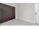 Foyer featuring gray tile floors and a set of double doors with a decorative panel design at 734 Flamingo Dr, Apollo Beach, FL 33572