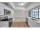 Bright kitchen with white cabinets, quartz countertops, and stainless steel appliances at 734 Flamingo Dr, Apollo Beach, FL 33572