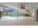 Spacious screened-in lanai featuring a pool, ceiling fans, and clear views of the outdoors at 734 Flamingo Dr, Apollo Beach, FL 33572
