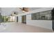 Large screened-in lanai, complete with ceiling fans and views of the kitchen through sliding glass doors at 734 Flamingo Dr, Apollo Beach, FL 33572