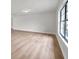 Bright living room with new vinyl plank flooring and a large window providing natural light at 734 Flamingo Dr, Apollo Beach, FL 33572