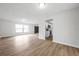 Bright living room with new wood-look flooring, white walls and plenty of natural light at 734 Flamingo Dr, Apollo Beach, FL 33572