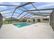 Beautiful pool area under a screen enclosure, offering privacy and a relaxing outdoor space at 734 Flamingo Dr, Apollo Beach, FL 33572