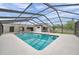Refreshing pool area with a screen enclosure, providing a private and enjoyable outdoor retreat at 734 Flamingo Dr, Apollo Beach, FL 33572