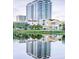 A high-rise building is beautifully reflected in the tranquil lake waters on a bright day at 777 3Rd N Ave # 1607, St Petersburg, FL 33701
