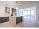 Modern kitchen with sleek cabinetry, island with breakfast bar, and large windows with city views at 777 3Rd N Ave # 1607, St Petersburg, FL 33701