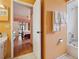 Bathroom leading to the bedroom, showcasing the layout at 7810 Flintlock Dr, Port Richey, FL 34668