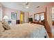 Bedroom with pink walls, wood floors, and a four-poster bed at 7810 Flintlock Dr, Port Richey, FL 34668