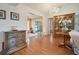 Traditional living room with wood floors, classic furnishings, and view to the sunroom at 7810 Flintlock Dr, Port Richey, FL 34668