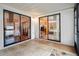 Tiled patio with sliding glass doors leading to the living room and bedroom at 7810 Flintlock Dr, Port Richey, FL 34668