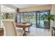 Lovely dining area with sliding glass doors offering pool and backyard views at 820 Newberger Rd, Lutz, FL 33549