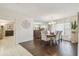 Bright dining room featuring elegant furnishings, hardwood floors, and ample natural light at 820 Newberger Rd, Lutz, FL 33549