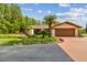 Charming single-story home with well-manicured landscaping, a two-car garage, and inviting curb appeal at 820 Newberger Rd, Lutz, FL 33549