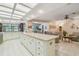 Open-concept kitchen with a large island and a seamless flow into the living area at 820 Newberger Rd, Lutz, FL 33549
