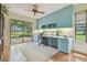 Sunlit office with custom cabinetry and serene lake views at 820 Newberger Rd, Lutz, FL 33549