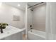 Bathroom with modern tub, shower, and a stylish vanity with sleek hardware at 8485 Pelican Ln, Seminole, FL 33777