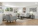 Bright living room featuring modern decor, neutral tones, and lots of natural light from large windows at 8485 Pelican Ln, Seminole, FL 33777