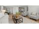 Inviting living room showcasing stylish furniture, a patterned rug, and a cozy atmosphere at 8485 Pelican Ln, Seminole, FL 33777