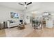 Bright living space with hardwood floors, a comfortable couch, and an open floor plan at 8485 Pelican Ln, Seminole, FL 33777