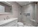 Beautiful bathroom featuring modern fixtures, a glass-enclosed shower, and a vanity with granite countertop at 8526 Quarter Horse Dr, Riverview, FL 33578