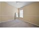 Neutral bedroom with carpet flooring, closet and natural light, ideal for relaxation and comfort at 8526 Quarter Horse Dr, Riverview, FL 33578