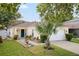 Charming single-story home featuring a welcoming entrance, well-manicured lawn and mature landscaping at 8526 Quarter Horse Dr, Riverview, FL 33578