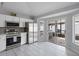 Contemporary kitchen with stainless steel appliances and a sliding glass door to a screened patio at 8526 Quarter Horse Dr, Riverview, FL 33578