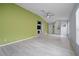 Bright living room featuring modern flooring and neutral walls, offering a flexible living space at 8526 Quarter Horse Dr, Riverview, FL 33578