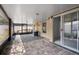 Covered brick patio with a built in bar and fan at 8526 Quarter Horse Dr, Riverview, FL 33578
