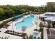 Community pool featuring a hot tub, splashpad, and lounge chairs at 8526 Quarter Horse Dr, Riverview, FL 33578
