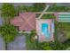 Aerial view of community pool, clubhouse, and shuffleboard courts at 8701 40Th N Ln, Pinellas Park, FL 33782