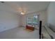Bright bedroom with a window, closet and ceiling fan with light fixture at 8701 40Th N Ln, Pinellas Park, FL 33782