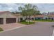 Residential street view of villas with barrel tile roofs and well-maintained landscaping at 8701 40Th N Ln, Pinellas Park, FL 33782