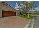 Villa with a brick paver driveway, two-car garage and manicured front lawn at 8701 40Th N Ln, Pinellas Park, FL 33782