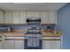 Modern kitchen with stainless steel appliances and ample counter space at 8701 40Th N Ln, Pinellas Park, FL 33782