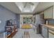 Bright kitchen featuring a central island, stainless steel appliances, and unique lighting at 8701 40Th N Ln, Pinellas Park, FL 33782