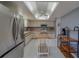 Well-lit kitchen equipped with stainless steel refrigerator, range, oven and wooden countertops at 8701 40Th N Ln, Pinellas Park, FL 33782