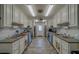 Efficient community kitchen with stainless steel appliances and ample counter space for catering and events at 8701 40Th N Ln, Pinellas Park, FL 33782