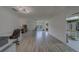 Spacious and bright living room with an office area and kitchen access at 8701 40Th N Ln, Pinellas Park, FL 33782