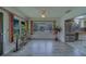 Inviting living room featuring natural light from many windows and stainless fridge at 8701 40Th N Ln, Pinellas Park, FL 33782