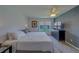 Comfortable bedroom featuring a bed, dresser, and a view of the outdoors at 8701 40Th N Ln, Pinellas Park, FL 33782