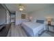 Inviting bedroom with stylish décor, a plush bed, and a view into the adjoining bathroom at 8701 40Th N Ln, Pinellas Park, FL 33782