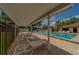 Inviting community pool area with lounge chairs and covered seating offers a relaxing atmosphere at 8701 40Th N Ln, Pinellas Park, FL 33782
