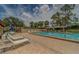 Open-air community pool with plenty of deck space and lounge chairs for relaxing at 8701 40Th N Ln, Pinellas Park, FL 33782