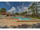 The community pool features clear, refreshing water, a spacious deck, and convenient entry steps at 8701 40Th N Ln, Pinellas Park, FL 33782