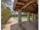 Recreational shuffleboard court area featuring covered seating perfect for outdoor community activities at 8701 40Th N Ln, Pinellas Park, FL 33782