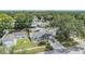 Aerial view of home showcasing curb appeal, lush landscaping, and neighborhood at 9056 108Th Ave, Seminole, FL 33777